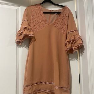 Pink dress with short bell sleeves. Good quality. Never worn.